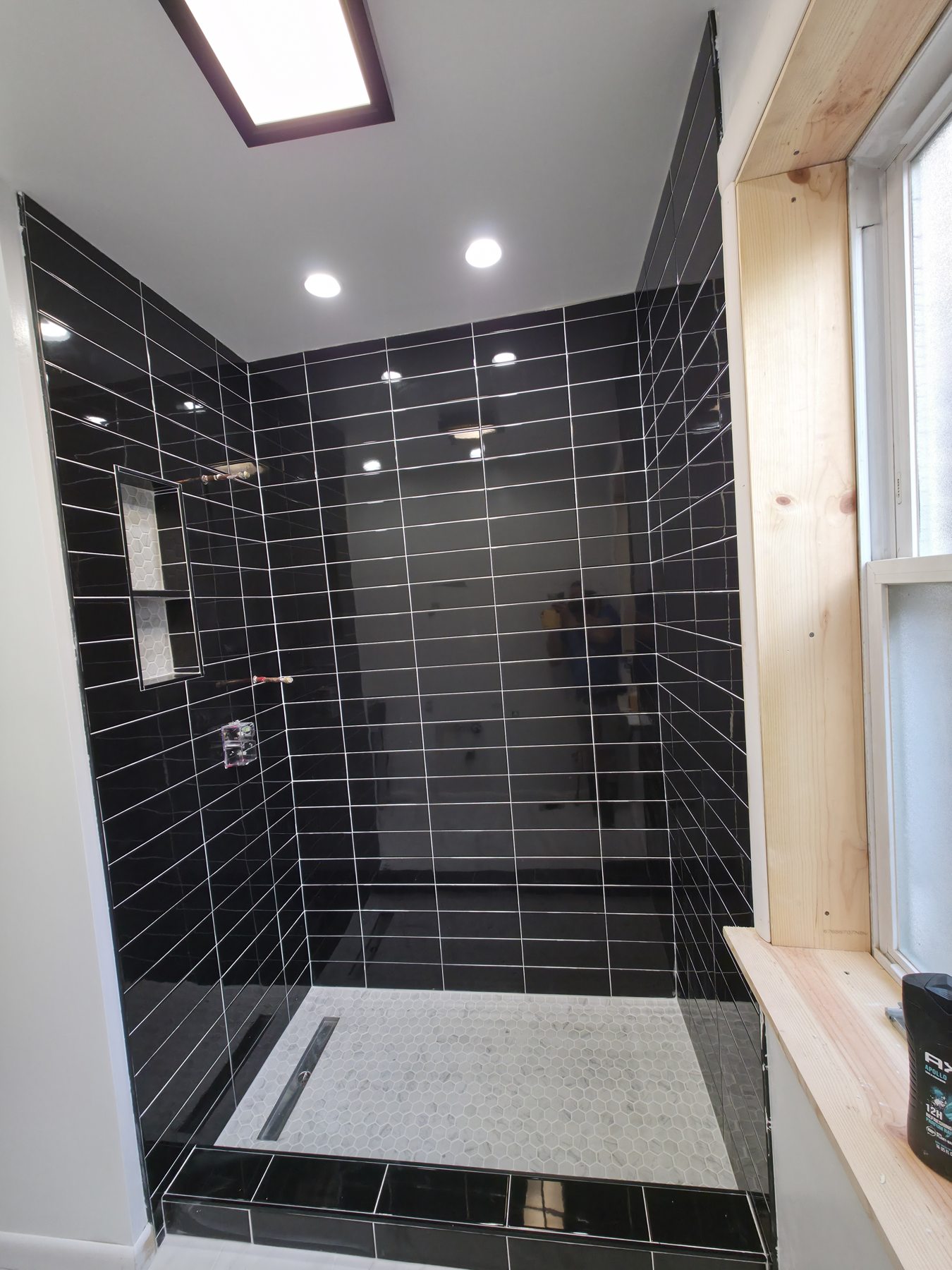 Black tiled shower and ceiling details